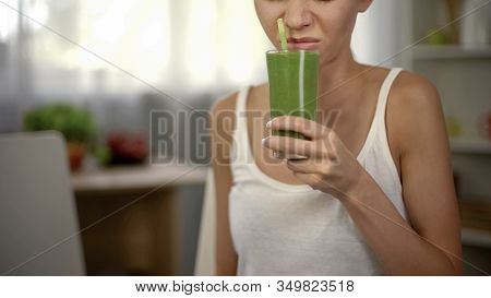 Girl Smells Smoothie For Weightloss, Disgust Emotion, Tasteless But Healthy Diet