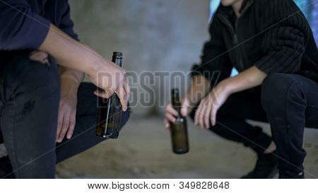 Drunkards Holding Beer Bottles Resting In Abandoned House, Social Issue, Problem
