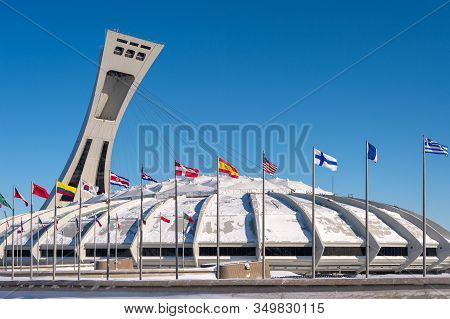 Montreal, Ca - 8 February 2020: The Montreal Olympic Stadium And Its Inclined Tower In Winter