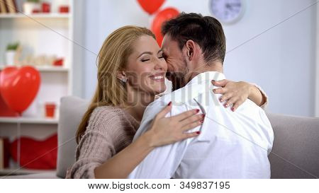 Passionate Husband And Wife Nuzzling And Hugging, Spending Holiday Together