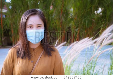 Woman In Mask Because Of Air Pollution And Epidemic In City. Protection Against Virus, Infection, Ex