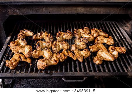 Fried Chiken Wings At Grill Barbecue. Restaurant.