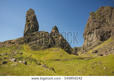 The Old Man Of Stoor, A 674m-tall Landslip Featuring A Steep, Rocky Face On A Cloudless Day Near Por