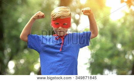 Superhero Boy Showing Muscles, Game As Psychotherapy For Child Confidence