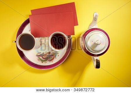 Teapot and cups used in traditional Chinese wedding ceremony with chinese sign meaning happinese. Translation: Double Happiness
