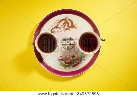 Teapot and cups used in traditional Chinese wedding ceremony with chinese sign meaning happinese. Translation: Double Happiness
