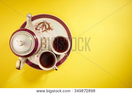 Teapot and cups used in traditional Chinese wedding ceremony with chinese sign meaning happinese. Translation: Double Happiness