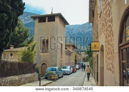 Deia, Mallorca, Spain - March 19 2018: Tourists Walking In The Streets Of Deia Town At The West Coas