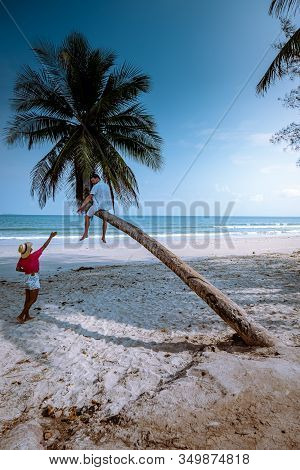 Thung Wua Laen Beach Chumphon Thailand, Couple On The Beach By Palm Tree Hanging On The White Beach