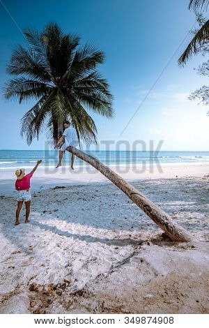 Thung Wua Laen Beach Chumphon Thailand, Couple On The Beach By Palm Tree Hanging On The White Beach