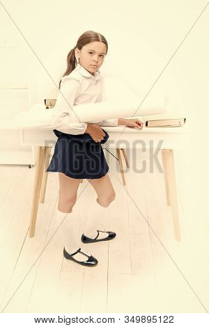 Serious About Own Project. Girl Hold Whatman Paper. Kid School Uniform Strict Face Ready With Her Pr