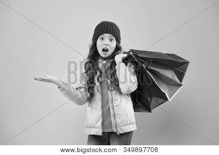 Falling Prices. Surprised Shopper Presenting Product Pink Background. Small Child On Shopping Sale. 