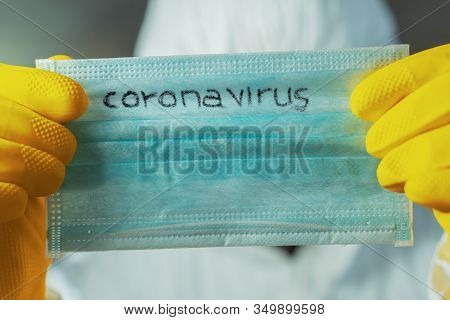 Epidemiologist Holding Coronavirus Respiratory Mask, Close Up