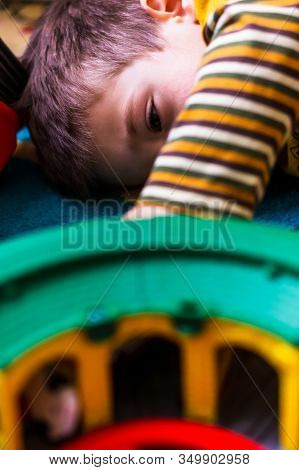 Poznan, Poland - January 19, 2020: Close Up Of A Small Young Polish Caucasian Boy Playing With A Pla