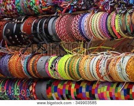 Colorful Souvenir Woven Traditional Friendship Bracelets On Market Stall Out On Street In Luxembourg