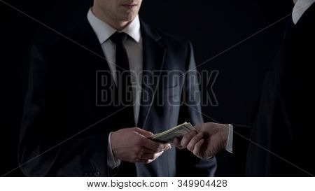 Tax Officer Takes Dollars Banknotes, Accepting Bribe, Informer Receiving Payment