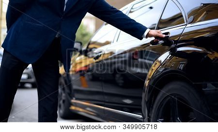 Personal Driver Opening Backseat Door In Car For Successful Businessman, Service