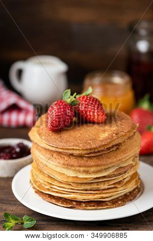 Thin Pancakes Or Crepes Or Blini. Tasty Sweet Breakfast Food. Rustic Background
