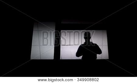 Silhouette Of Man Patient In Lunatic At Asylum Window, Psychosocial Disabilities