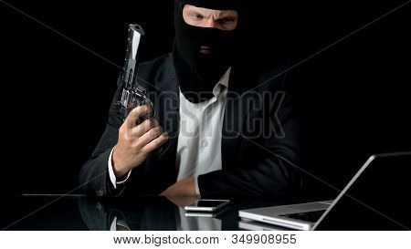 Mafiosi With Gun Using Laptop, Break In Bank Security System, Crime Preparation