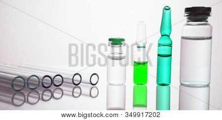 Group Of Vials With Medication On Blue Methacrylate Table. Horizontal Composition.