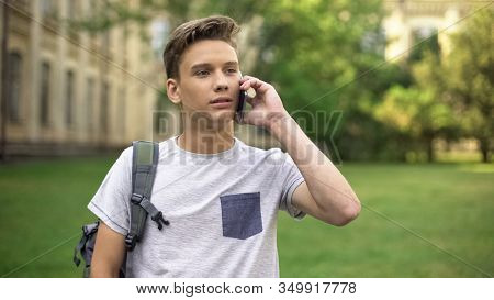 First Year Student Talking On Mobile Phone With Parents In Campus, Nostalgia