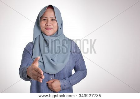 Muslim Businesswoman Offering Hand Shake