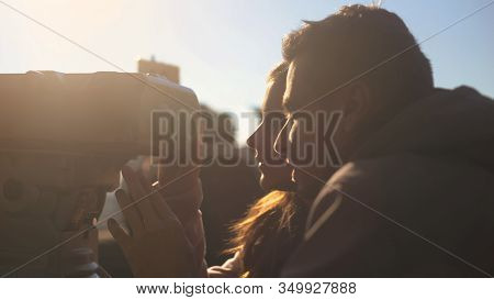 Man And Lady Looking To Tower Viewer On Skydeck, Enjoying Beautiful Cityscape
