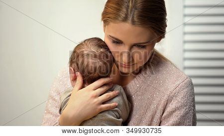 Tender Mommy Cuddling Adorable Little Baby, Holding Newborn In Arms, Love