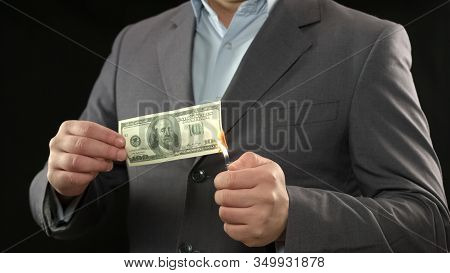 One Hundred Dollar Bill On Fire, Male Going Bankrupt, Losing Money, Inflation