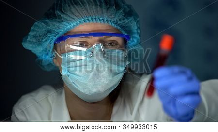 Medical Lab Worker Analyzing Blood Serum, Conducting Paternity Blood Test, Dna