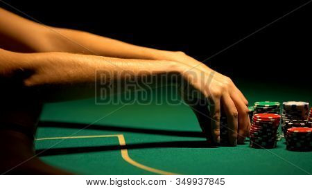 Woman Hand Playing Poker, Strategy And Betting All-in, Bluffing, Closeup