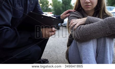 Officer Trying To Calm Down Female Victim Of Car Accident, Shocked Girl Crying