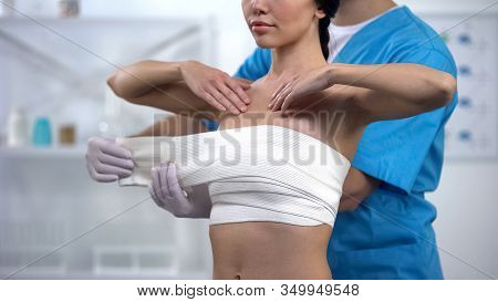 Professional Plastic Surgeon Wrapping Chest Compression Female Patient, Health