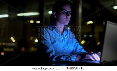 Woman Typing On Laptop At Night, Working Overhours In Office, Busy Lifestyle
