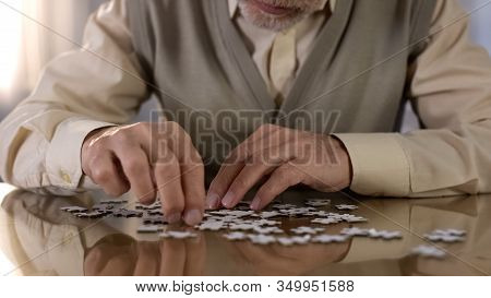 Grandfather Trying To Put Puzzle Together, Concentration Exercise, Motor Skills