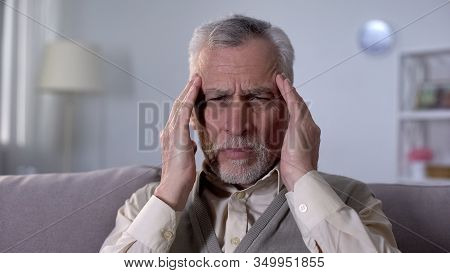 Old Man Suffering Migraine, Symptom Of Ischemic Stroke, Neurological Problems