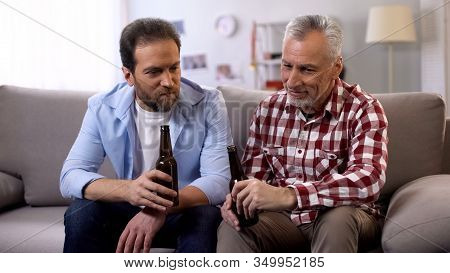 Father-in-law And Son Drinking Beer And Communicating, Relax Time, Togetherness