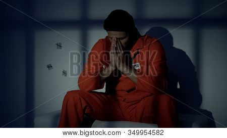Depressed Caucasian Prisoner Feeling Sorrow About Made Crime, Overthinking