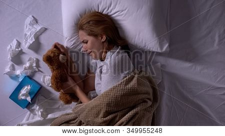 Depressed Woman In Bed Crying, Hugging Toy Bear, Suffering From Miscarriage