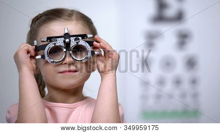 Pretty Girl In Optical Trial Frame Smiling Seeing Clearly, Vision Correction