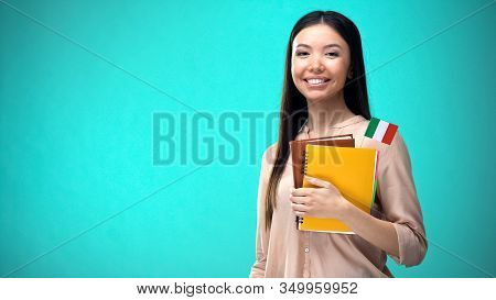 Cheerful Woman Holding Italian Flag Book, Education Abroad, Learning Language