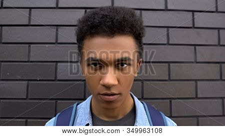 Black Boy Viciously Looking Into Camera, Bullying And Aggression In Adolescent