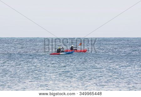 A Pair Of Kayakers In The Sea As An Emphasis Point