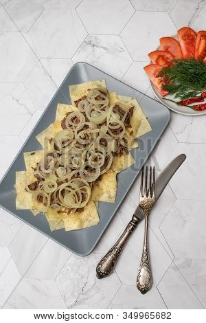Beshbarmak Is A National Kazakh Dish - Square Pasta With Boiled Meat And Onions.