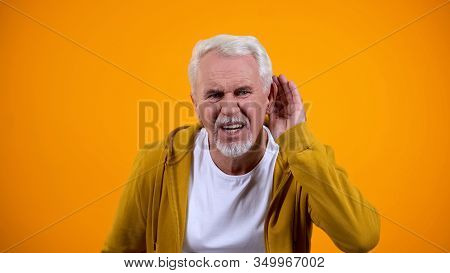 Senior Man Trying To Hear Interlocutor, Health Problems Of Aged People, Deafness