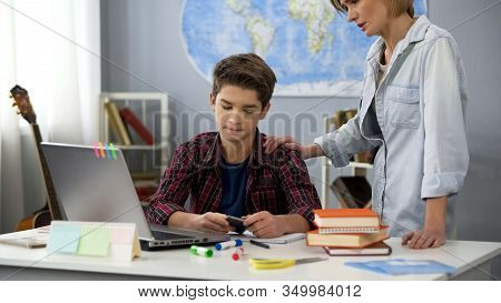 Mom Talking To Son Using Smartphone Instead Doing Homework, Generation Gap