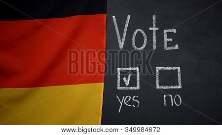 German Flag On Blackboard, Yes Answer Marked In Vote, President Election, Poll