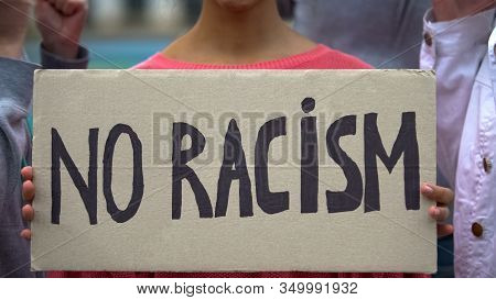 Mixed-race Girl Holds Sign No Racism, Suffers Crowd Screaming Racial Insults