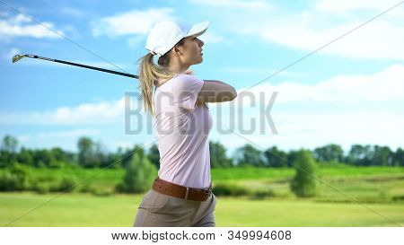 Woman Playing Golf In Backswing Position, Upset About Failed Shot, Loser Concept